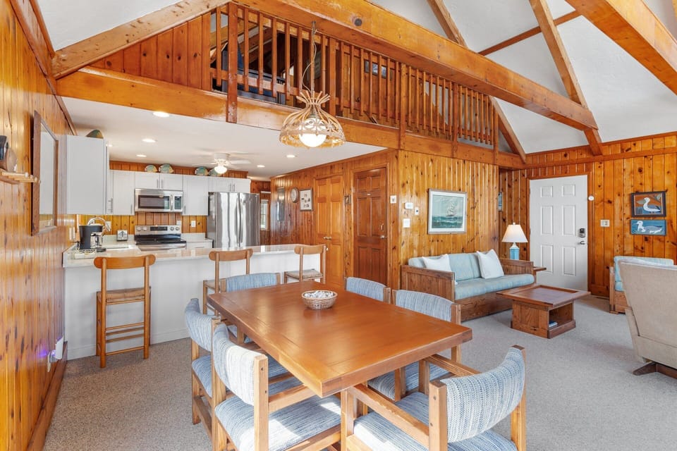 Get cozy in the Living Room surrounded by classic wooden paneling!