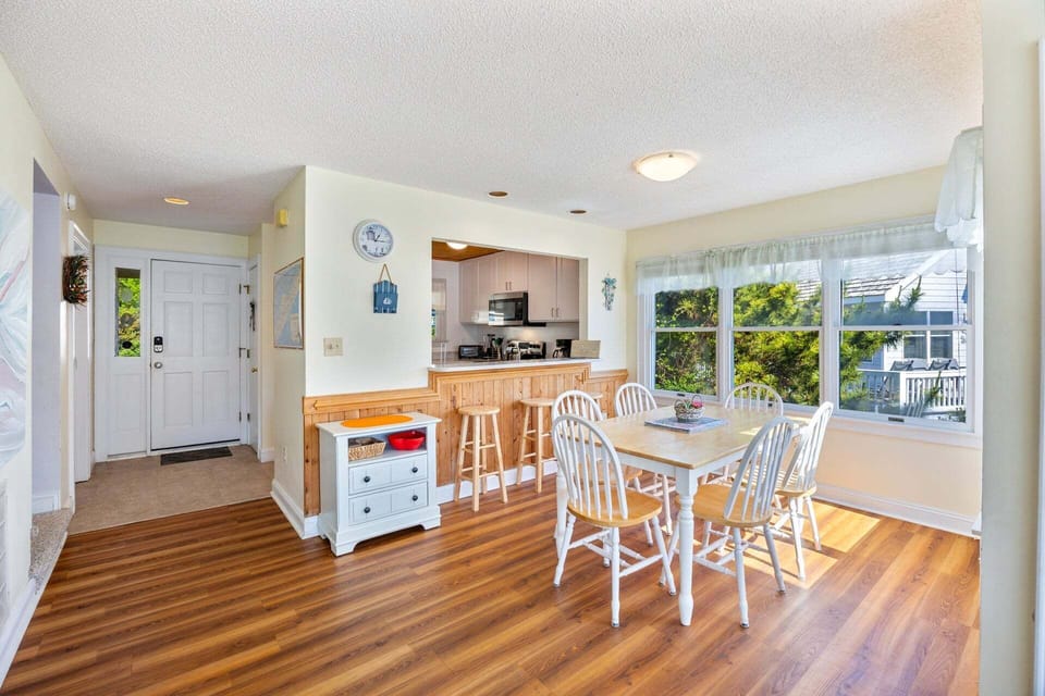 A kitchen bar, breakfast nook, and formal dining area offer plenty of seating options.