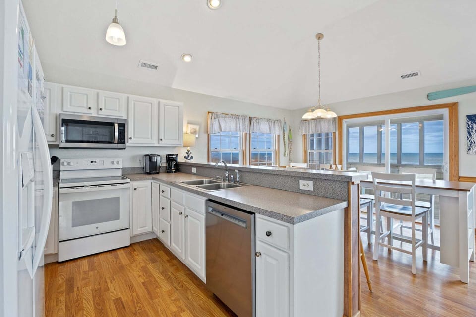 Whip up a fantastic meal in the Kitchen with all modern amenities, double sinks, and a Breakfast Bar that seats 3.