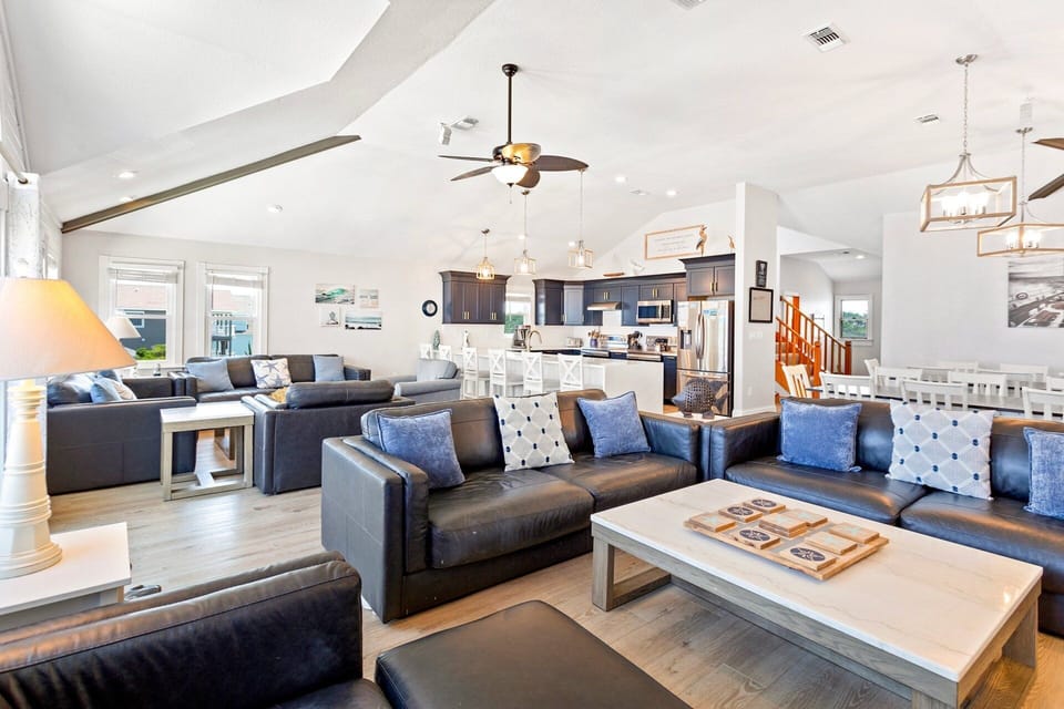 Beautifully appointed with an ocean of cozy furnishings, and a flat-screen TV with hook-ups/capabilities for iPod, video game consoles, and Netflix, the central living area is where families can unwind.