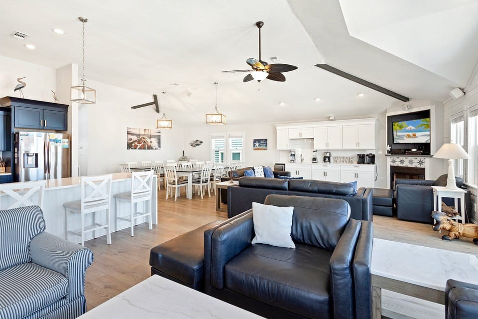 Beautifully appointed with an ocean of cozy furnishings, and a flat-screen TV with hook-ups/capabilities for iPod, video game consoles, and Netflix, the central living area is where families can unwind.