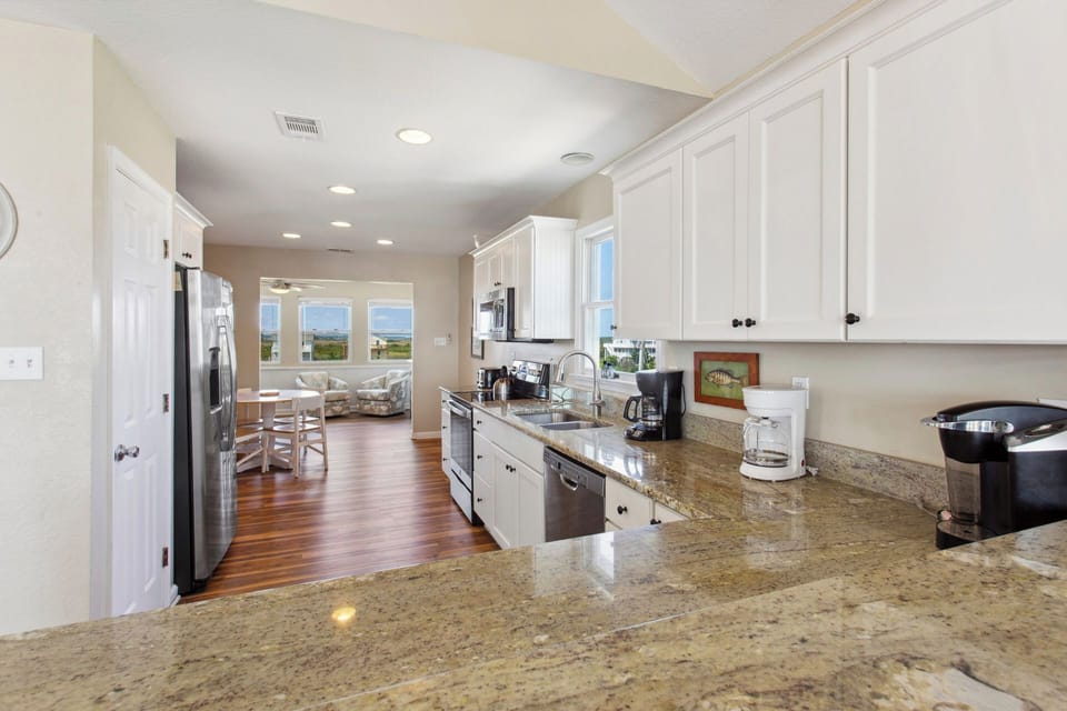 Feel right at home in a large kitchen with plenty of prep space and fully stocked with any appliance you might need including a Keurig coffee maker and free-standing ice maker.