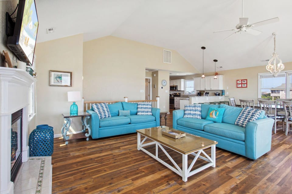 Unwind in the open-style Living Area with vaulted ceilings and plenty of natural light.