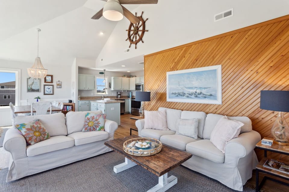 Relax in the spacious Living Area with a flat-screen TV and plenty of light filtering in through the windows!