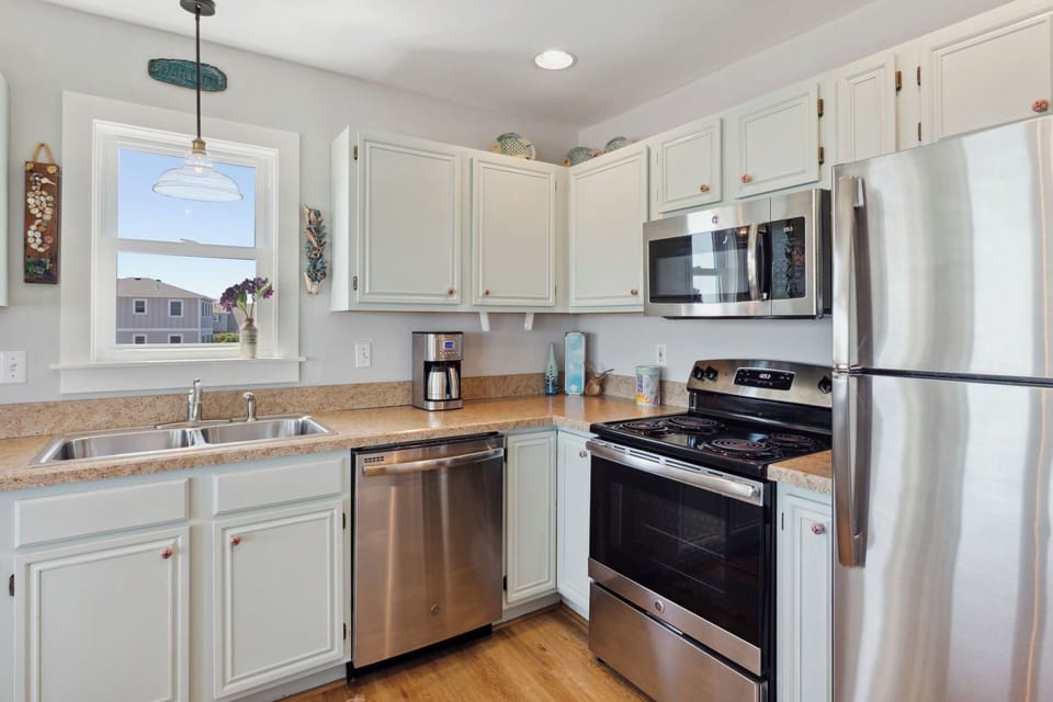 The fully-equipped Kitchen with modern appliances is perfect for whipping up something delicious for the whole family to enjoy.