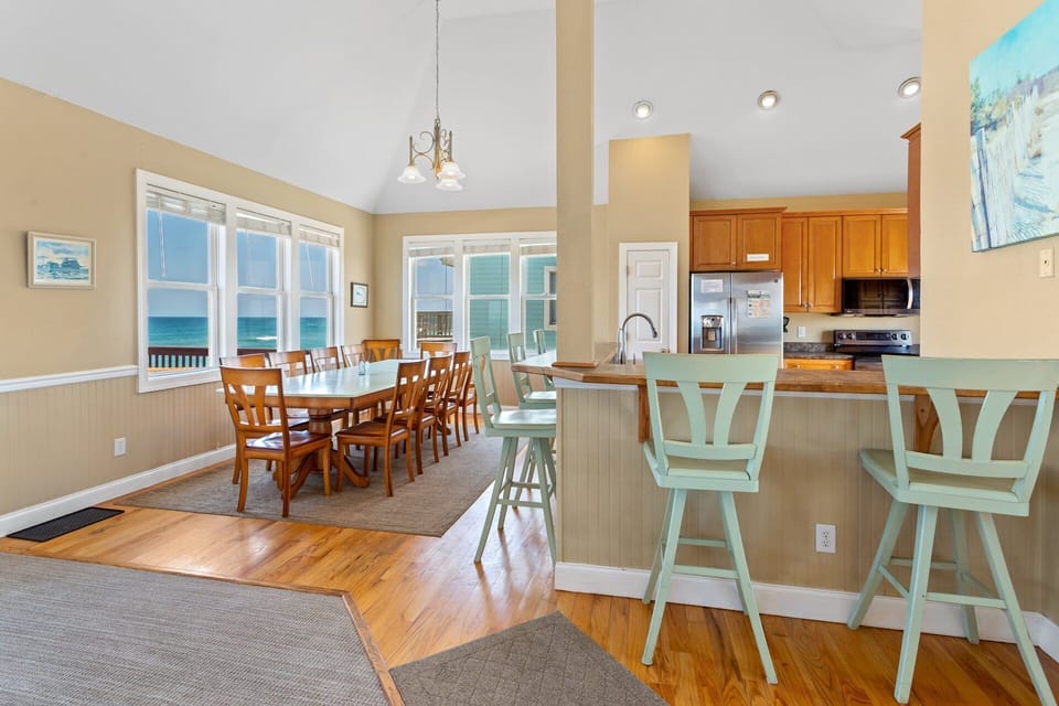 The dining area seats ten and offers breathtaking ocean views, making mealtime a memorable experience.