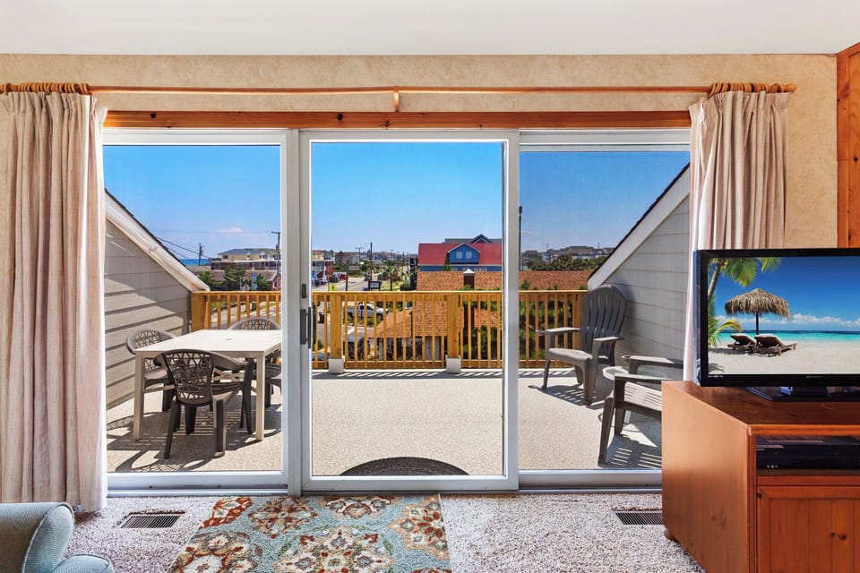 Settle in to enjoy the light filtering in through the glass sliding doors.