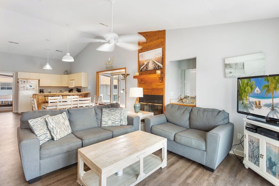 Gather around for a family movie or game night in the open-concept Living Area with Flat Screen TV and comfortable furniture.
