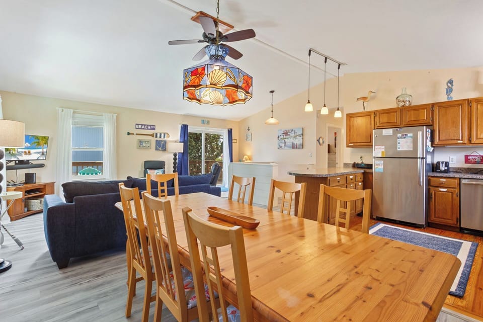 The dining table has space for 8 and doubles as the perfect place to play a round of cards or a fun board game!