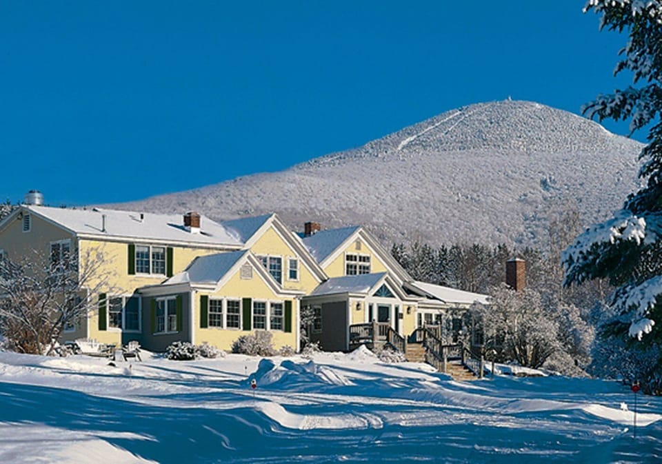 The Red Clover Inn Main House with Pico Mountain background (winter))
