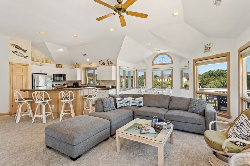 Relax in the spacious Living Area with a Flat Screen TV and plenty of sunshine.