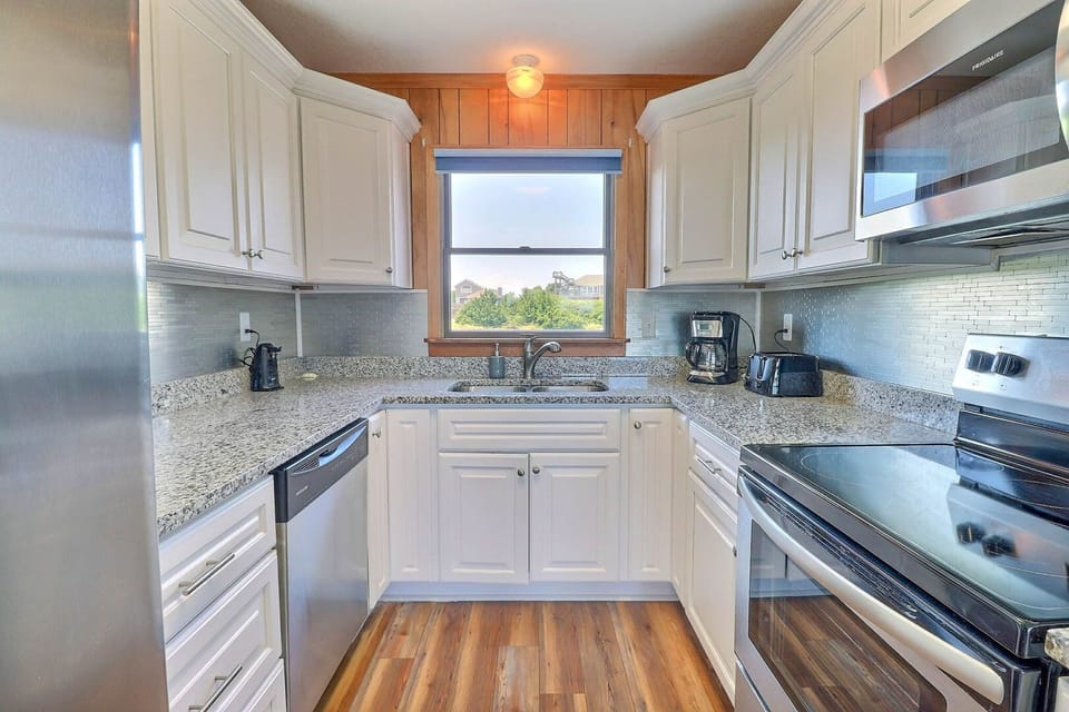 Whip up something delicious in the Kitchen with modern appliances and plenty of prep space.
