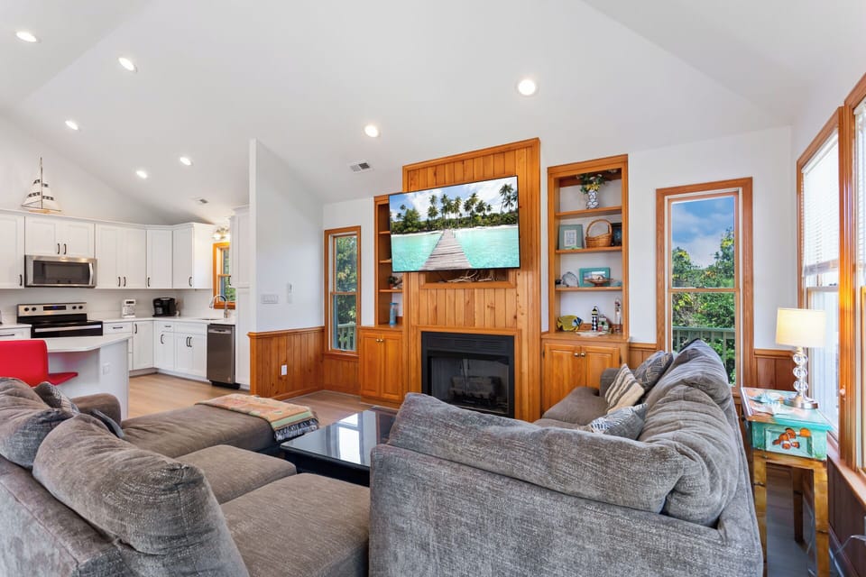 Relax in the spacious Living Area with high ceilings and a large Flat Screen TV!