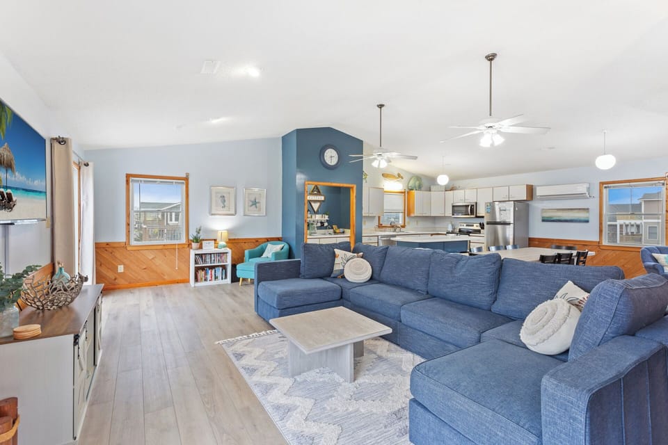 Relax in the spacious Living Area with high ceilings and beautiful interior decor.