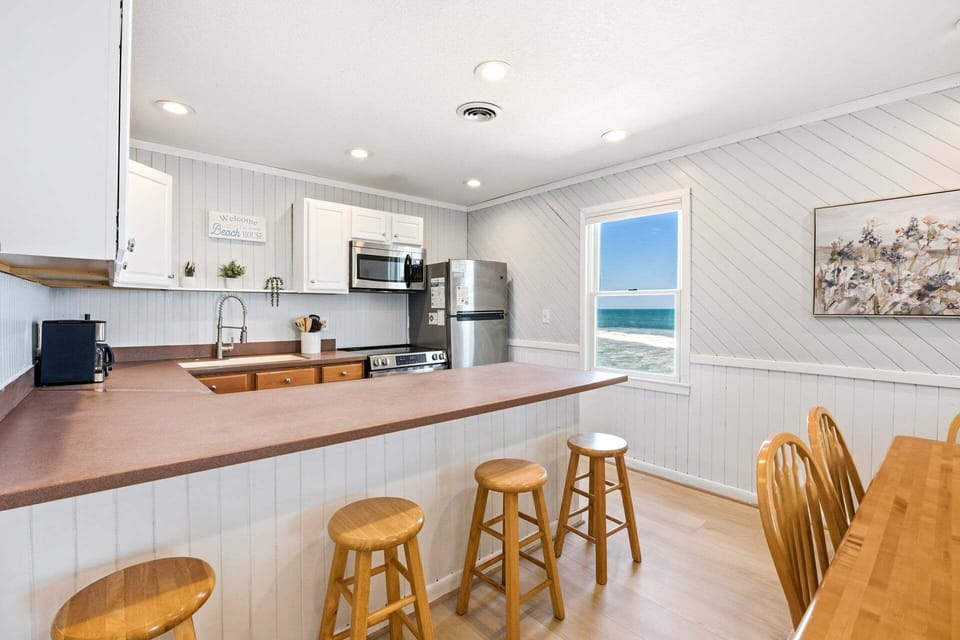 Kitchen: Cook with ease in the fully equipped kitchen featuring modern appliances and a dishwasher.