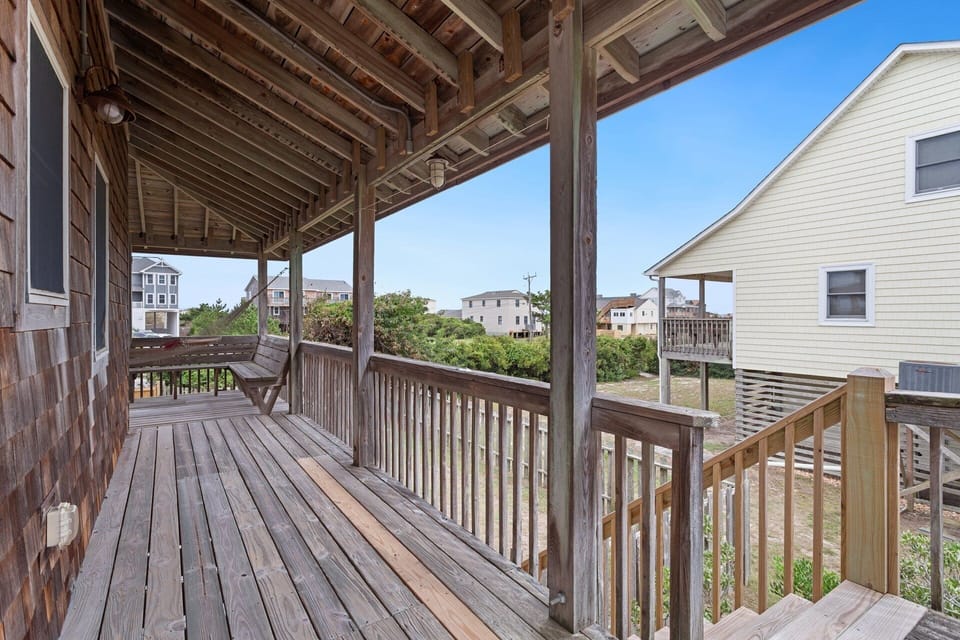 Wraparound Porch: Relax in the shade on the spacious covered porch with hammocks, swings, and plenty of seating.