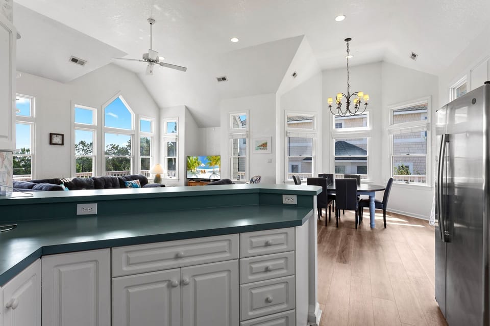 The modern kitchen is fully equipped for preparing breakfast, dinner, or casual snacks during your vacation.