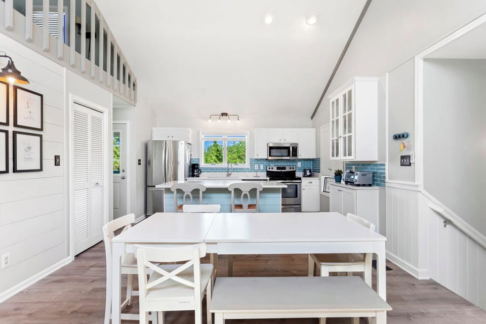 Eat together in the bright Dining Area after making a delicious meal in the modern Kitchen.