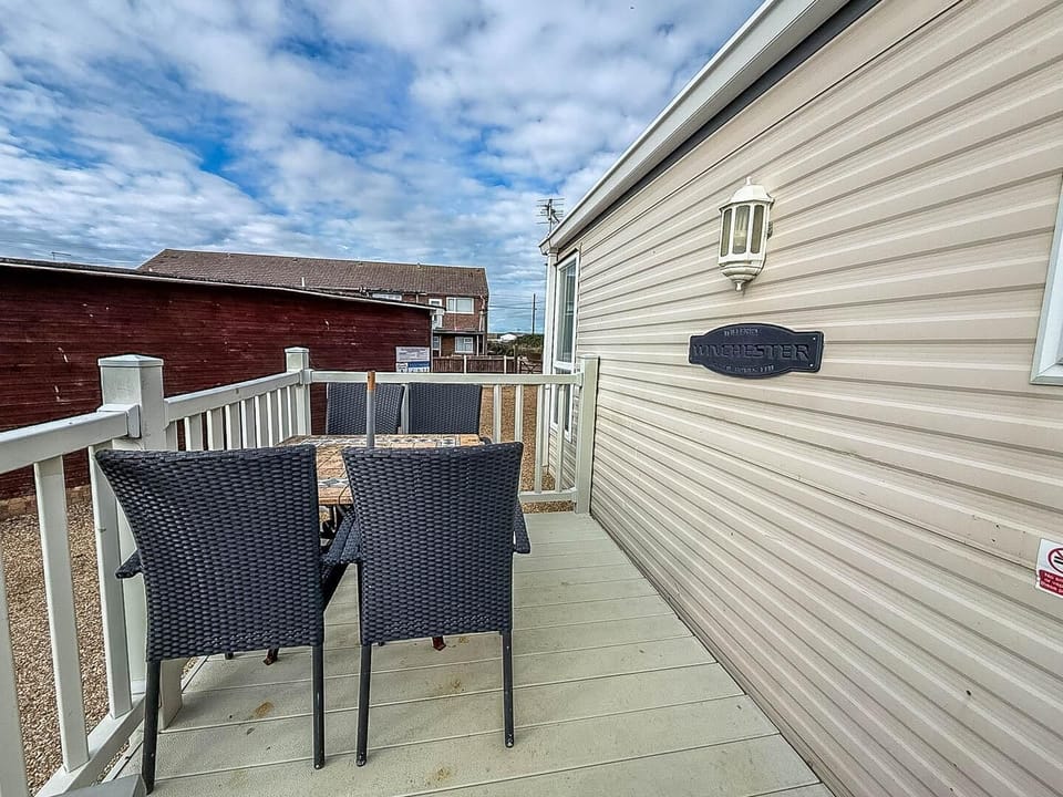 The decking area extends your living space, perfect for enjoying a morning coffee or letting your dog play safely.