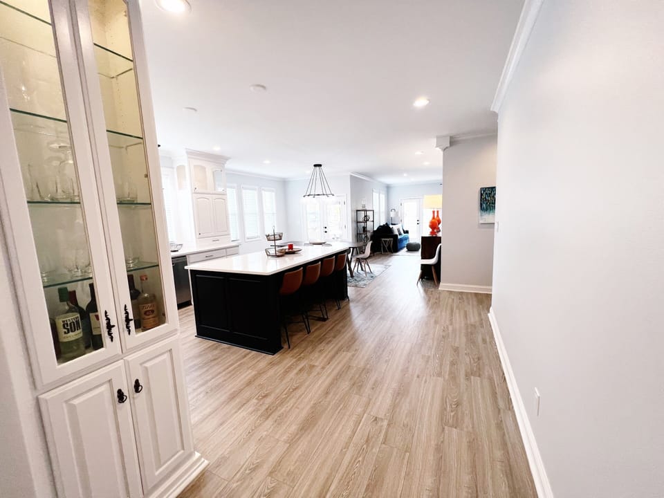 Open kitchen, dining, living room with lake views. 