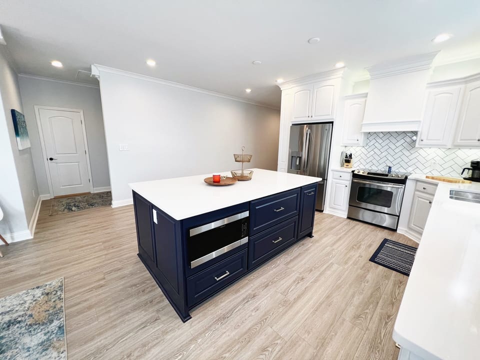 Microwave located in Kitchen island.