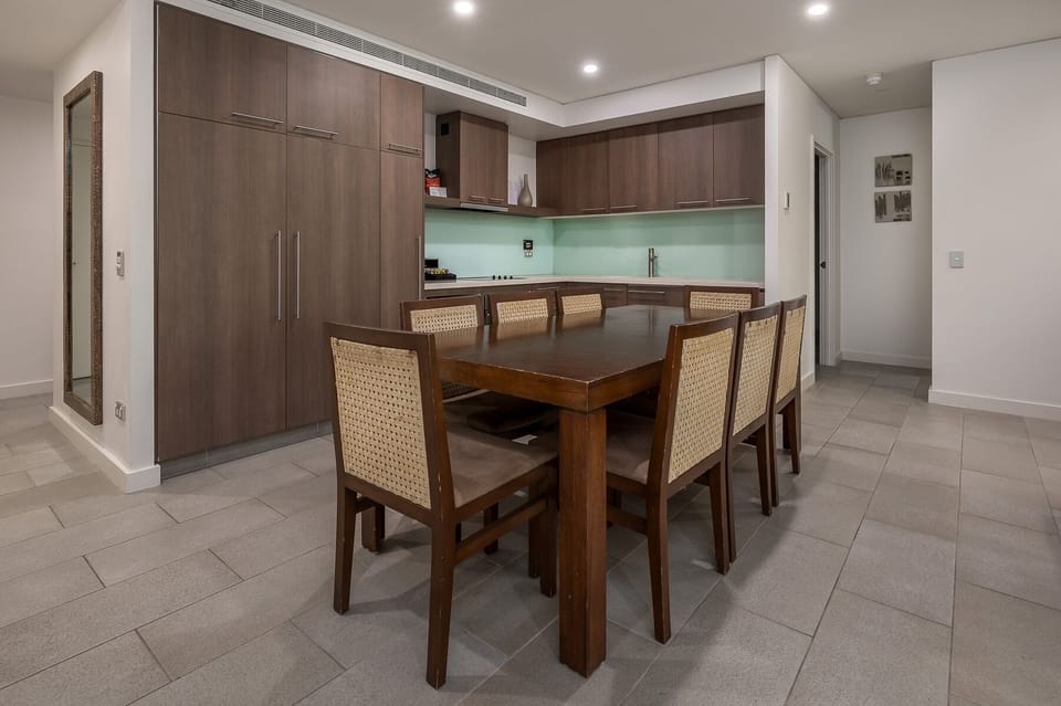 Dining comfortably fits 8 - behind those cabinets is a pantry & a fridge/Freezer