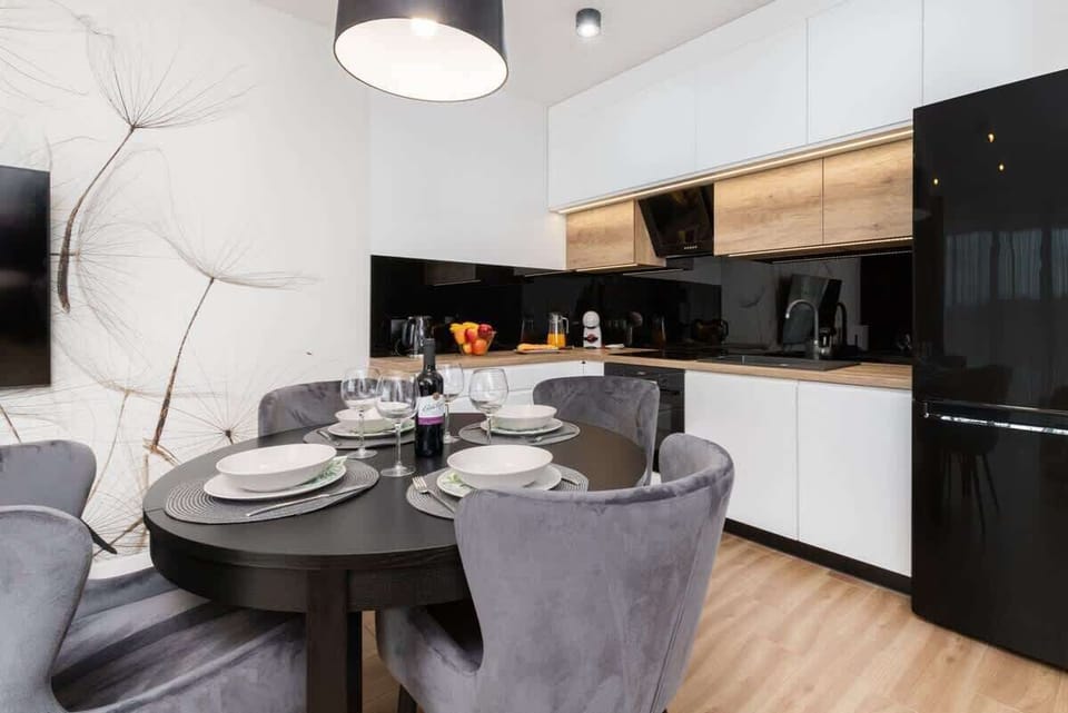 Bright kitchenette with cooking utensils. 