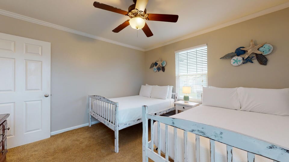 The guest bedroom offers a ceiling fan for your added comfort.