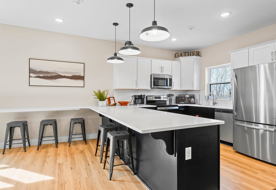 The dining and kitchen areas flow together, creating a seamless space for entertaining and enjoying meals together.