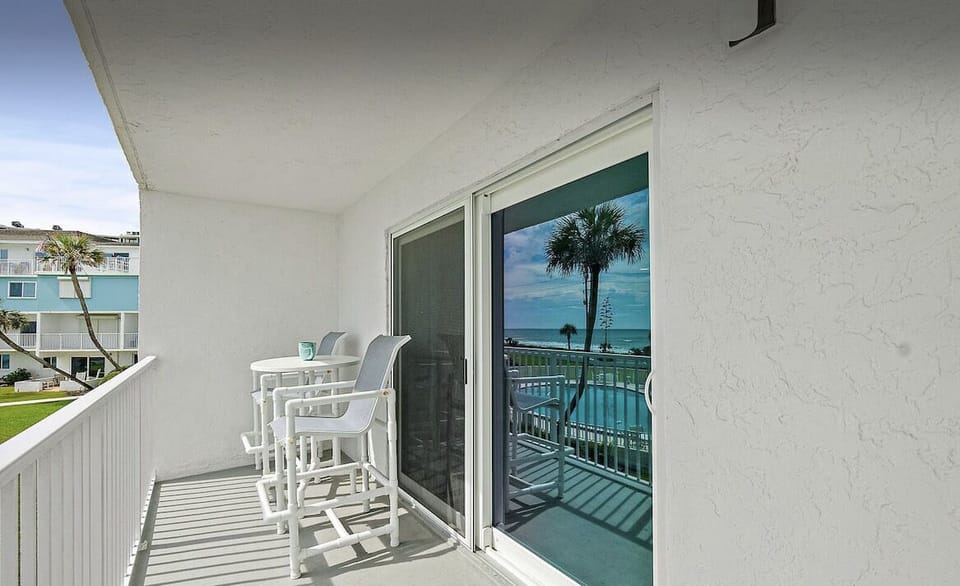 Enjoy your morning coffee while seeing the sun rise, dolphins,. & pelicans!