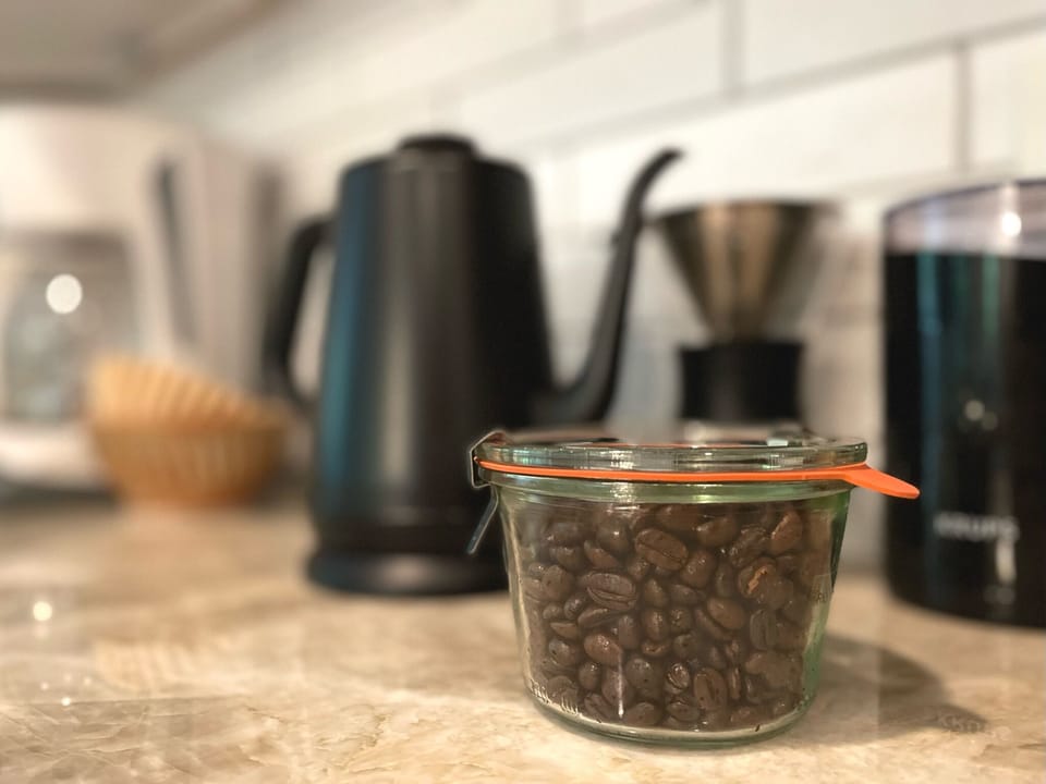Kitchen is stocked with local coffee to enjoy by pour over or drip coffee maker.