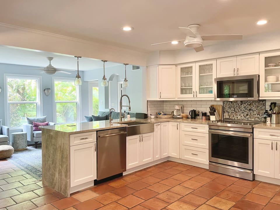 Renovated, open kitchen and dining room with family room open to private garden.