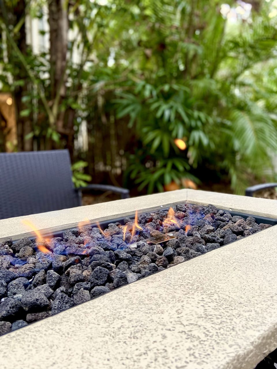 Enjoy fire pit and seating area on patio.