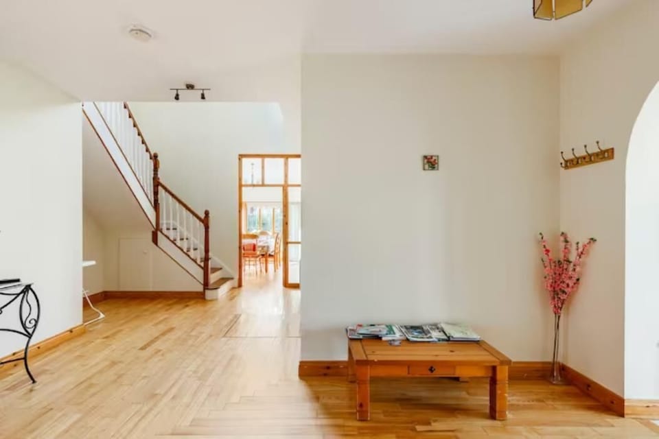 Bedroom 2 downstairs with 2 single beds bedside lockers and wardrobe.enjoys morning sunshine.