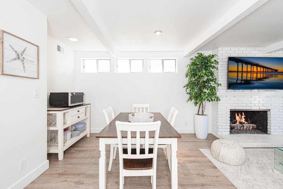 The dining area includes seating for four.
                