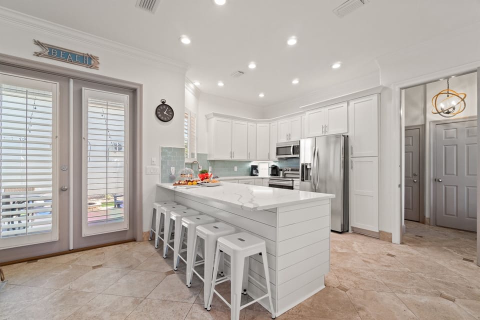 The breakfast bar has seating for six and the kitchen has endless prep space