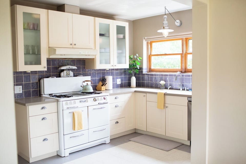 The spacious and bright kitchen includes the original 1940 Wedgewood stove.