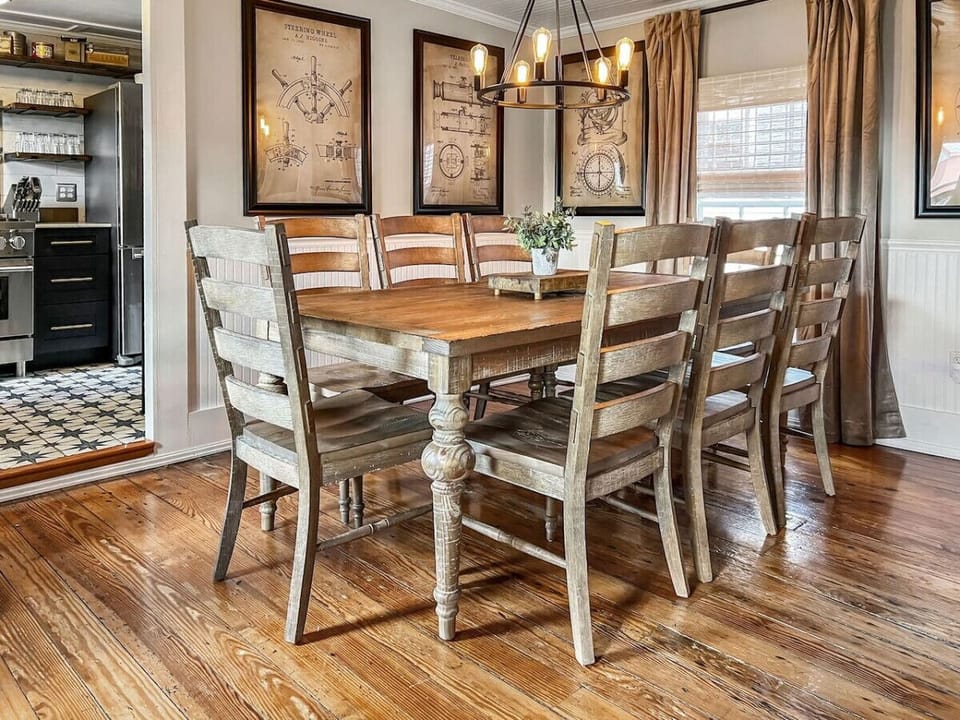 The dining room sits right off the kitchen at Higgins Downtown Depot—perfect for family meals and late-night laughs in New Bern.