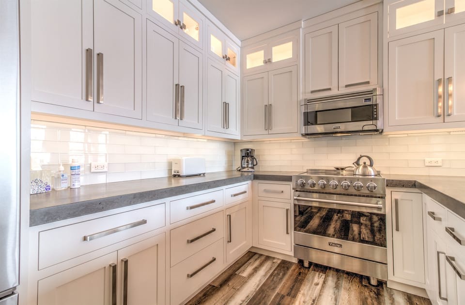 - Bright chef-style kitchen with premium appliances, stone countertops, and tall cabinetry - Open layout and warm lodge touches create a welcoming cooking space - Ideal for preparing après-ski meals and hosting cozy mountain gatherings