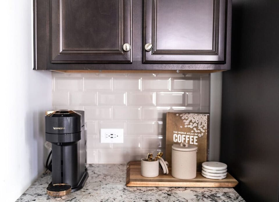 In addition to a regular coffee maker, there is also a Nespresso machine waiting for you.(Cary, North Carolina executive furnished rental)
