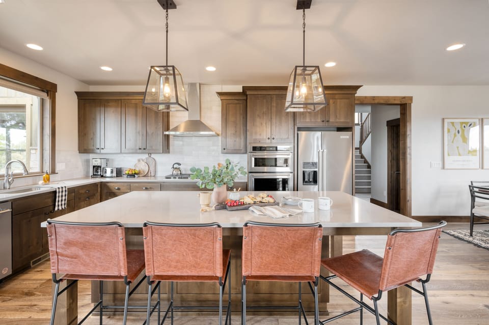 Island with barstool seating in the kitchen.