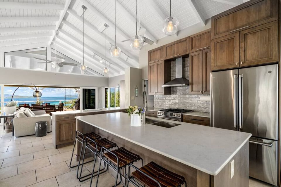 The well-appointed kitchen with bar area.