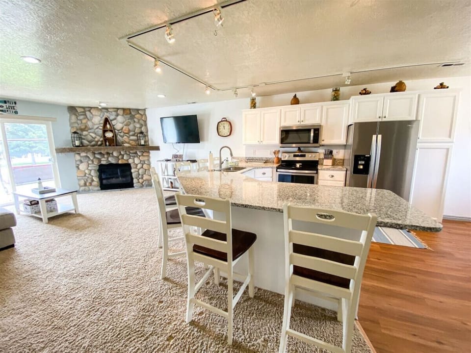 Modern kitchen with granite countertops and spacious breakfast bar