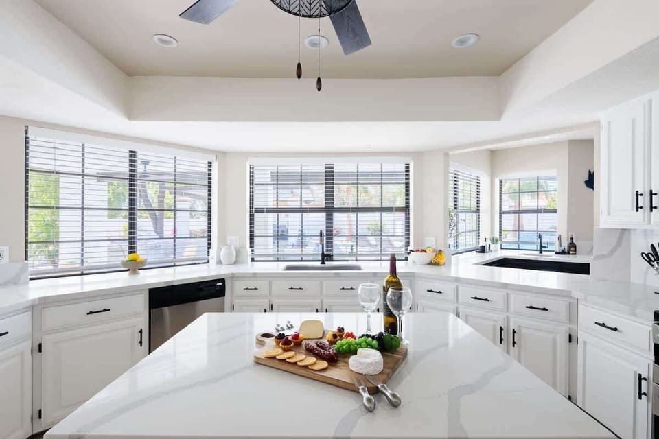 The fully equipped modern kitchen is stocked with all culinary essentials and stainless-steel appliances. (1st Floor)