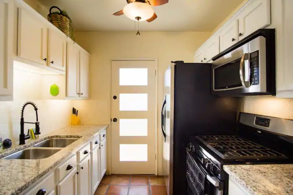 Full size refrigerator, gas stove, granite counters, microwave. Well Stocked.