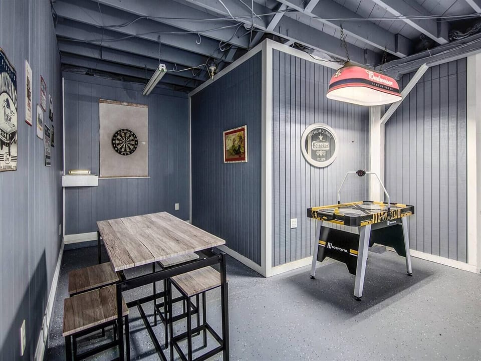 Game room with Connect Four (no longer an air hockey table) and darts
