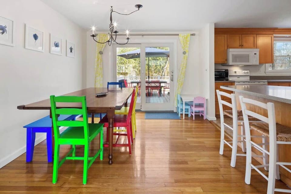 dining room with sliding doors to the back deck and yard.