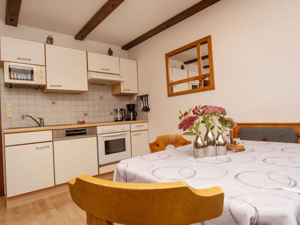 Countertop, Cabinetry, Furniture, Property, Flower, Table, Interior Design, Wood, Lighting, Orange