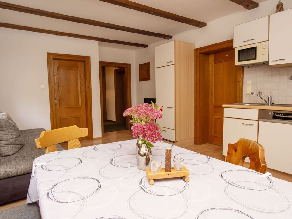 Flower, Furniture, Table, Property, Cabinetry, Plant, Building, Interior Design, Countertop, Couch