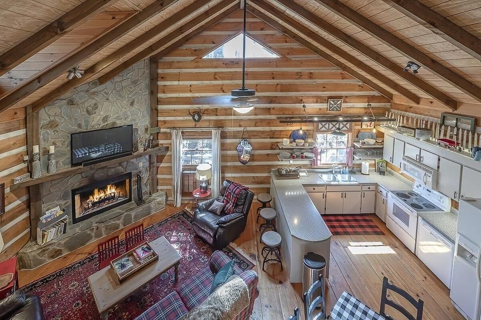 View of open living room/kitchen from loft
